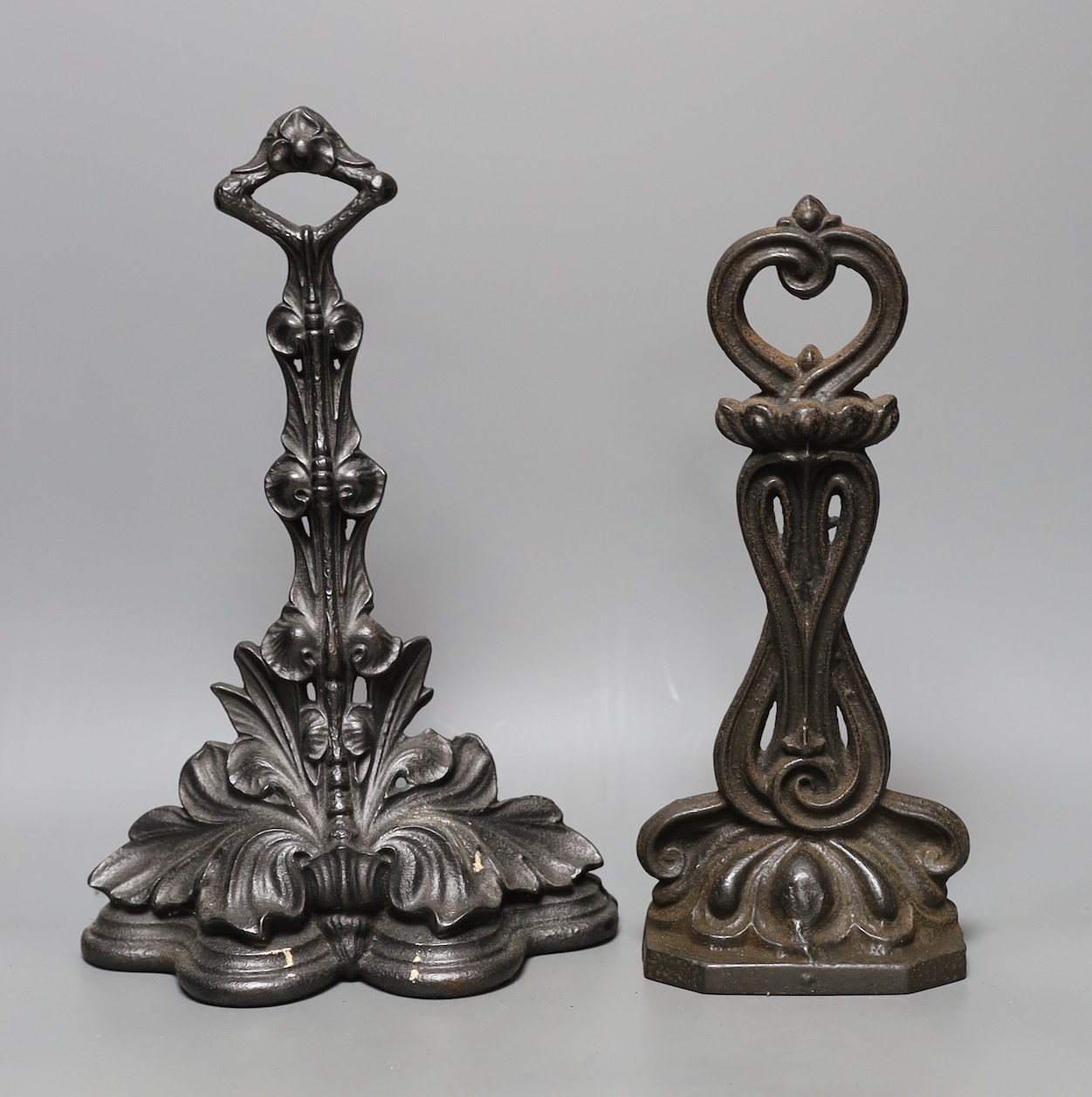 Five decorative cast iron door stops, tallest 35 cms high